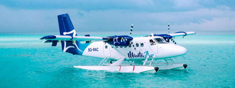 Interior of the Maldives seaplane terminal with directions to lounges and departures
