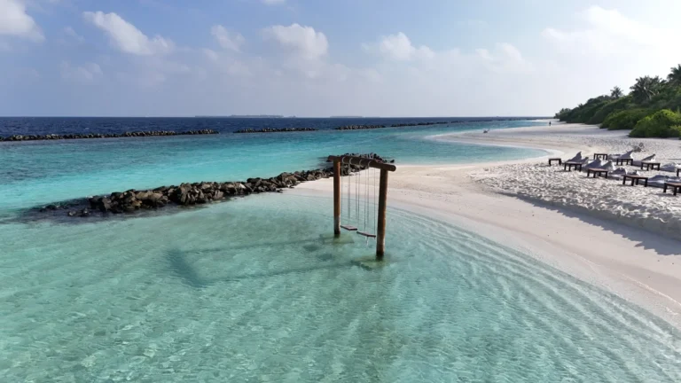 Niva Dhigali Maldives beach and lagoon with overwater swing
