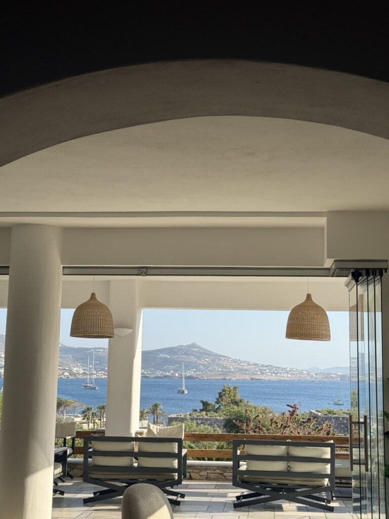Shaded seating area overlooking the sea at Paros Agnanti Resort