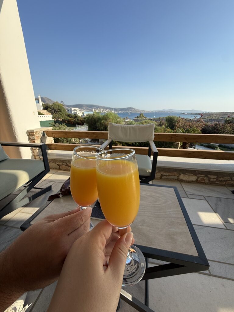 Two glasses of orange juice on the sea-view terrace at Paros Agnanti