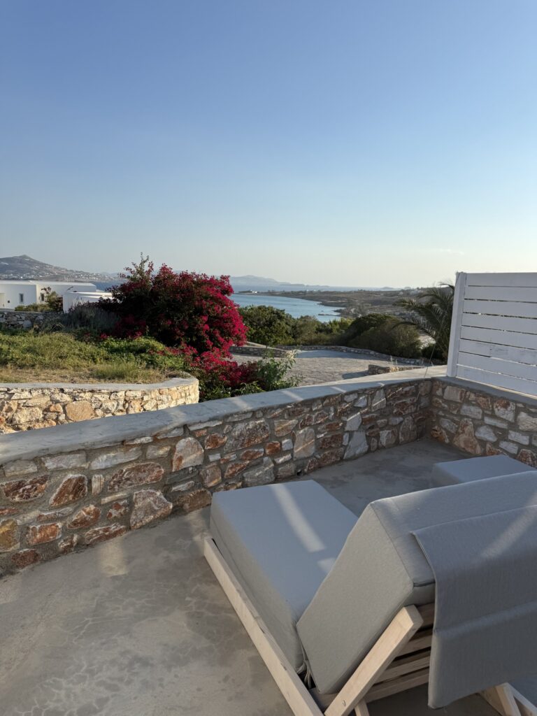 Sun lounger on the private stone terrace overlooking Paros