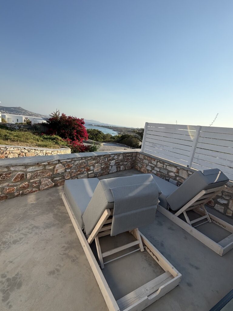 Sun loungers and privacy screen on our terrace at Paros Agnanti