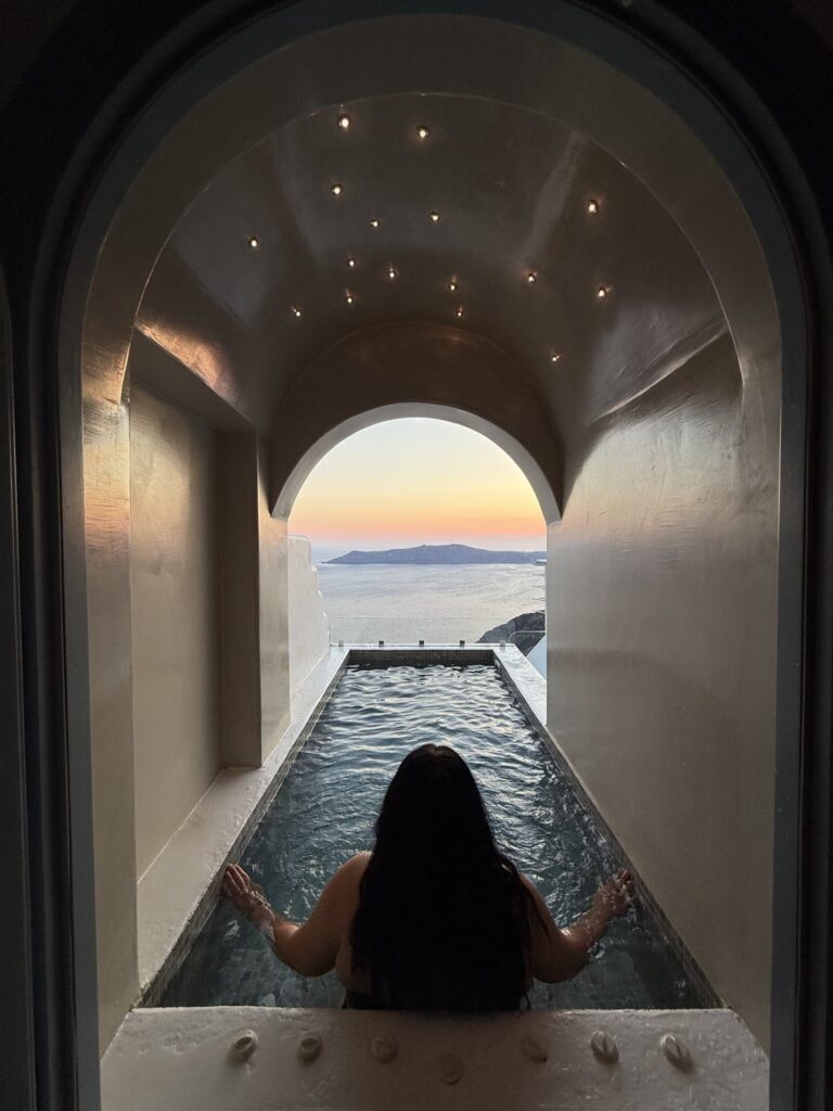 Private plunge pool in arched suite at sunset
