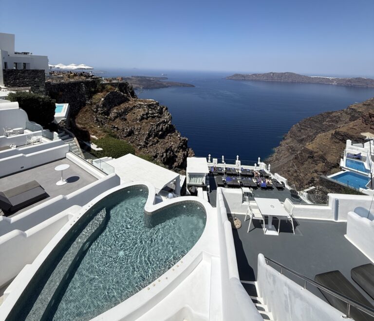 Private plunge pool overlooking Santorini caldera in daylight