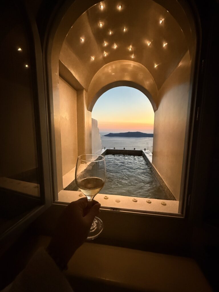 Wine by the private plunge pool at sunset