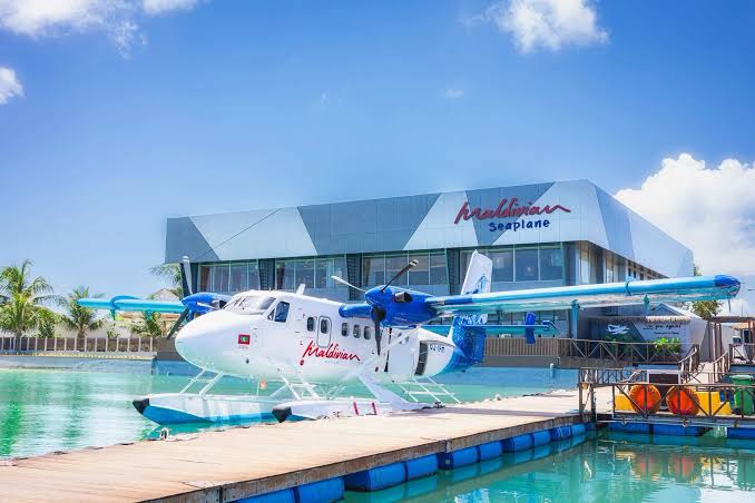 Seaplane terminal lounge terrace overlooking the water and seaplanes in the Maldives