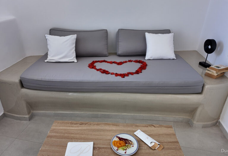Rose petals arranged in a heart in a romantic suite at Pegasus Suites and Spa in Santorini