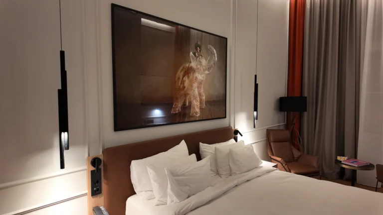 Radisson Collection Basilica Budapest guest room with king-size bed and modern pendant lighting